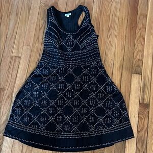 Lightweight black and white Leifsdottir racerback dress with brass buttons.